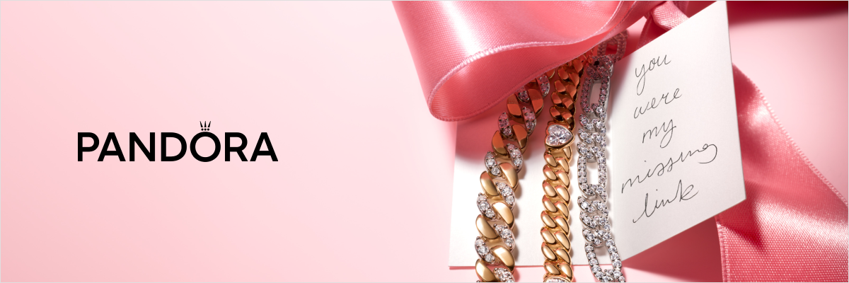 Pandora gold and silver link bracelets with sparkling cubic zirconia accents, styled with a pink satin ribbon and gift note reading “You were my missing link.”